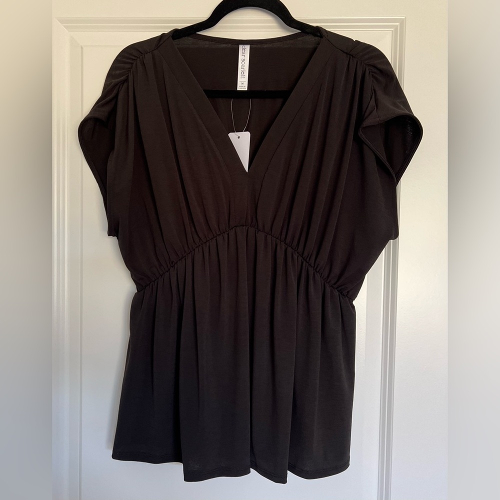 Women's sleeveless V neck dress. Elastic waist. Size M NWT.